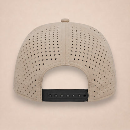 Apex hat, back view, tan perforated panels and a black adjustable snapback strap, on a plain beige background.