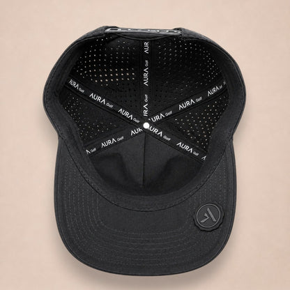 Noir hat, inside view, black lining with Aura Golf printed seam tape and a round logo patch under the brim.